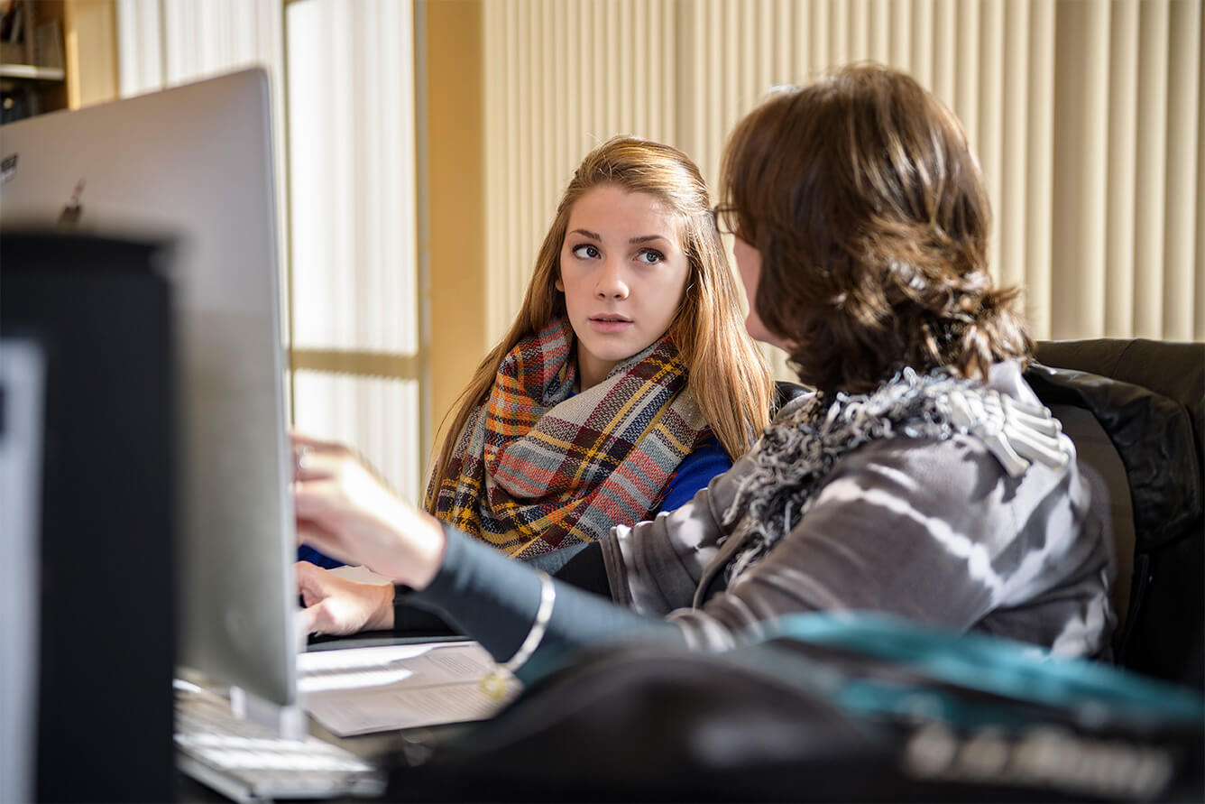 Student and teacher working together