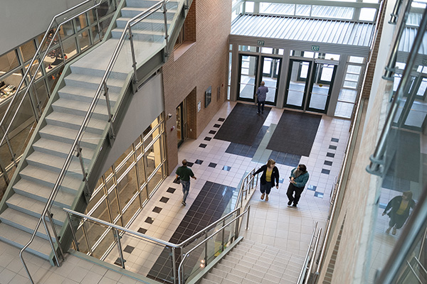 Employee guiding other students