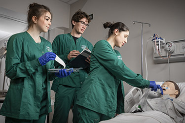 photo of nursing students working in a lab
