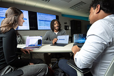 photo of students working in a lab on campus