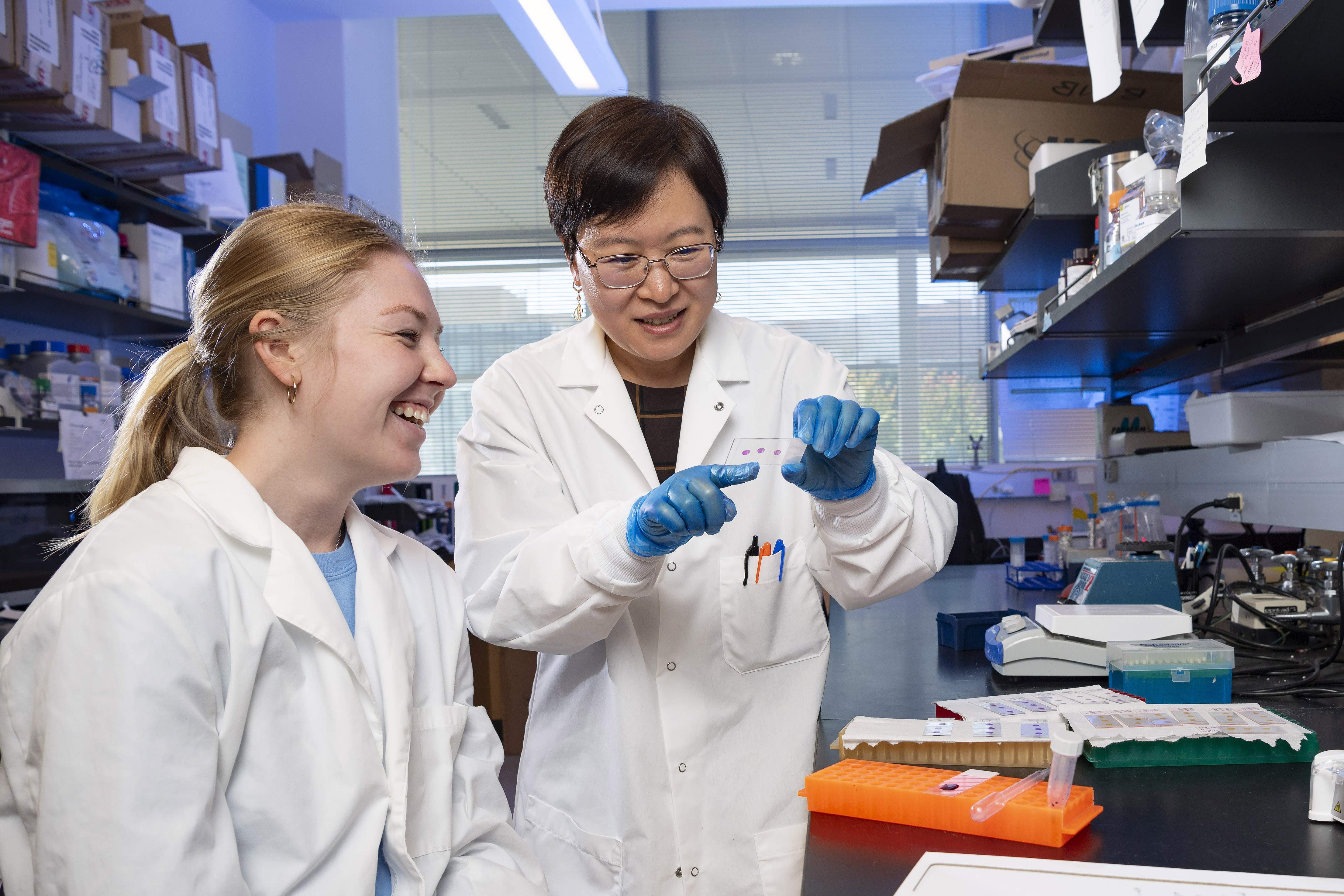 photo of a student and professor in a lab