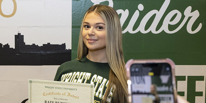 photo of a student posing for a photo in the student union