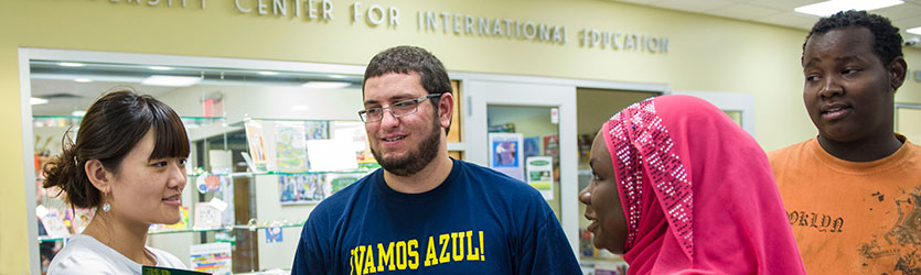 photo of students standing outside of the university center for international education