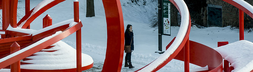 photo of a student standing outside on campus