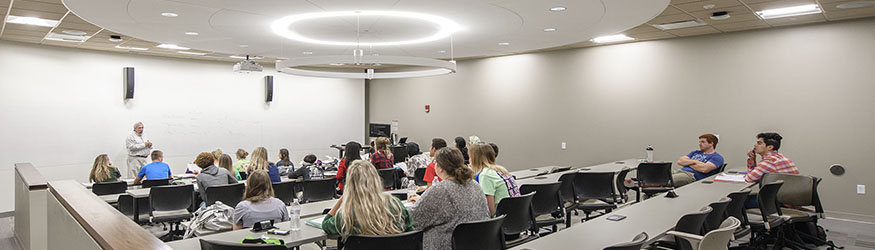 photo of a an instructor and students in a classroom
