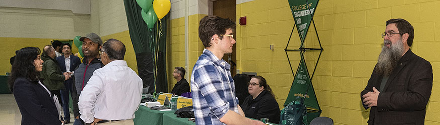 photo of people talking at an open house event