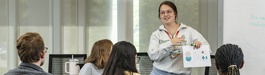 photo of a student leading a discussion