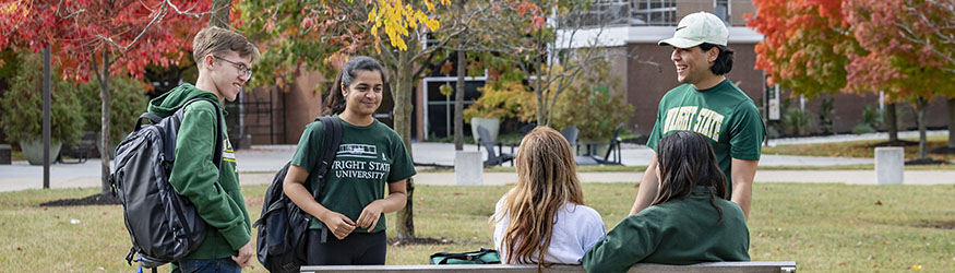 photo of a group of students outside on campus