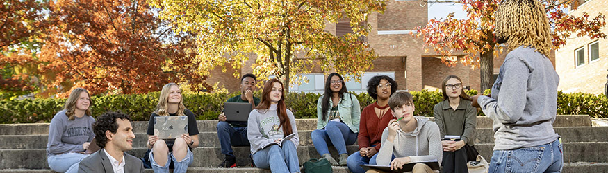 photo of an instructor and a class in the ampitheatre