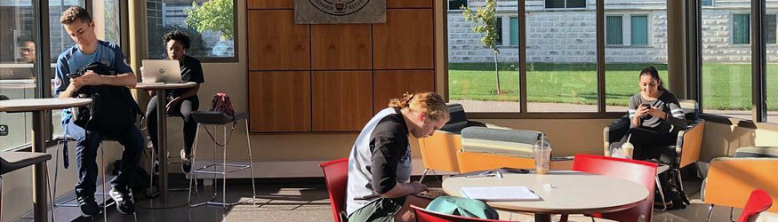 photo of students in reyrey cafe using devices