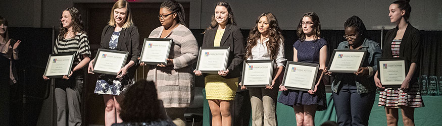 photo of student award recipients on stage