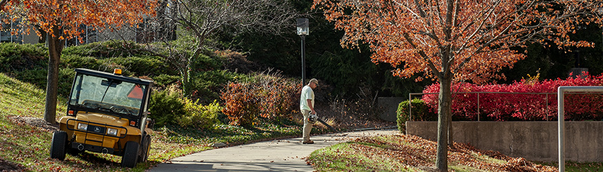 photo of an employee working outside on campus