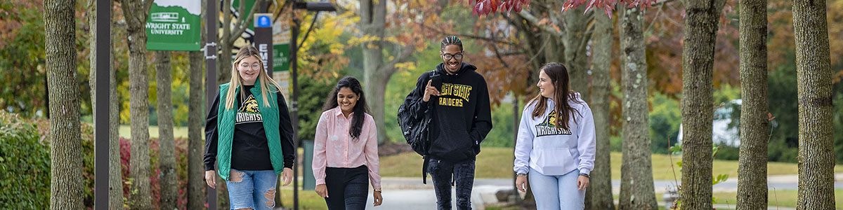 photo of students walking outside on campus 