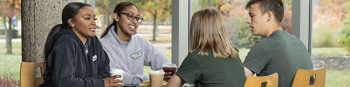 photo of students sitting at a table with food in the union market