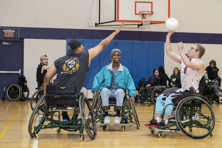 photo of students playing basketball in the student union gym