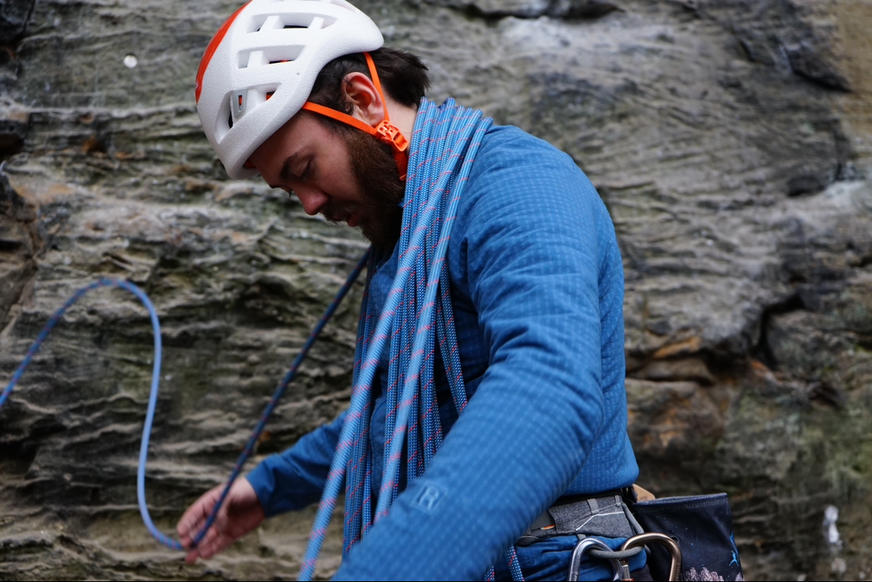 Climber getting rope ready to climb