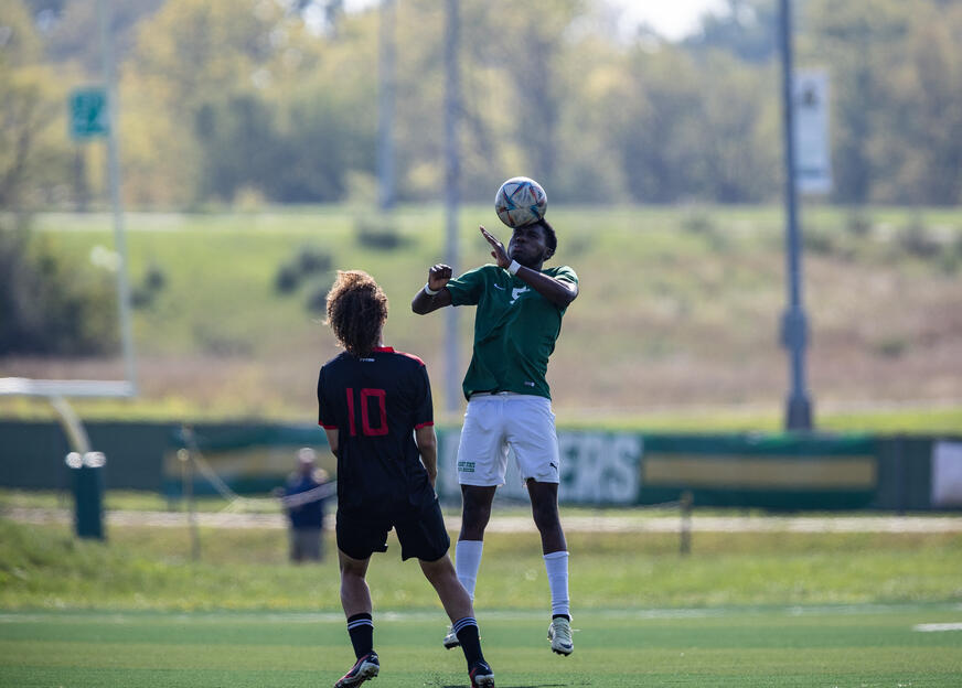 Soccer player going up for header