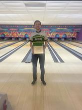 Nathan Minzler holding Player of the Year award